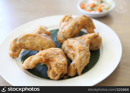 Fried chicken on wood background