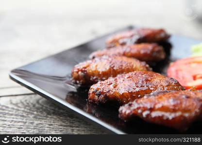 Fried chicken on wood background