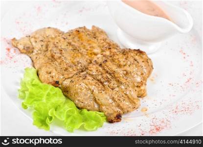 fried chicken steak with greens and lettuce
