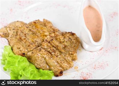 fried chicken steak with greens and lettuce