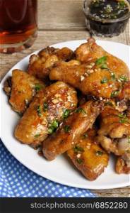Fried chicken wings in ginger garlic marinade with herbs