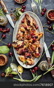 Fried chicken wings in spicy cherry sauce.Grilled chicken, fast food.. Chicken wings with cherries.