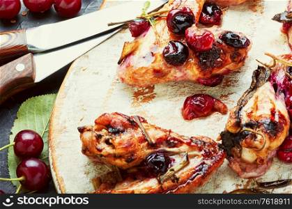 Fried chicken wings in spicy cherry sauce.Grilled chicken, fast food.. Chicken wings with cherries.