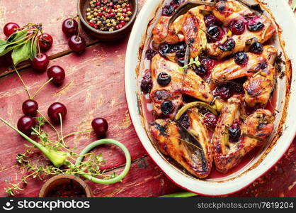 Fried chicken wings in spicy cherry sauce.Grilled chicken, fast food.. Chicken wings with cherries.