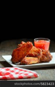 Fried Chicken Wings on wood background
