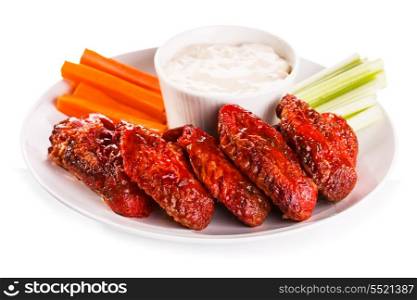 Fried Chicken Wings with vegetables on white background