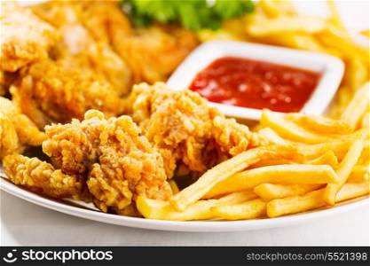 fried chicken with fries on a plate