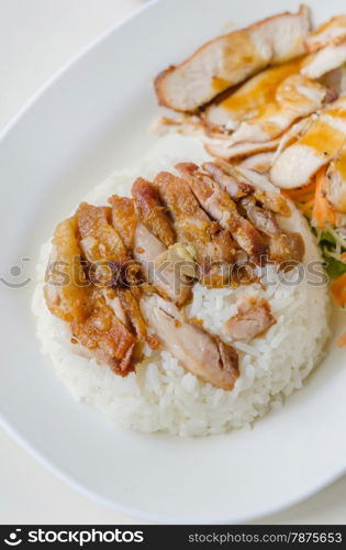 fried Chicken with rice . close up fried Chicken over steamed rice on plate