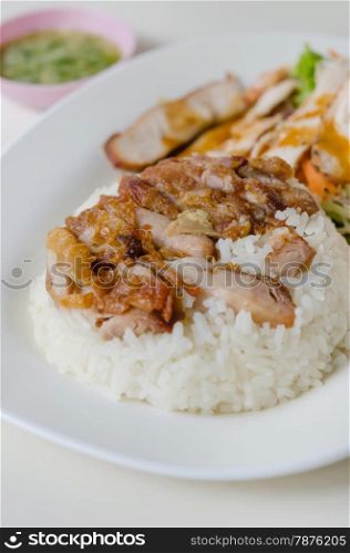 fried Chicken with rice . close up fried Chicken over steamed rice on plate