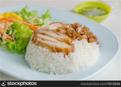 fried Chicken with rice . close up fried Chicken over steamed rice on plate