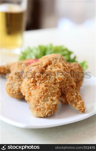 Fried Chicken with tomato vegetable and beer