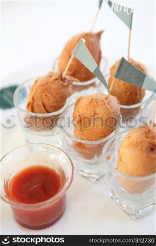Fried cocktail sausages