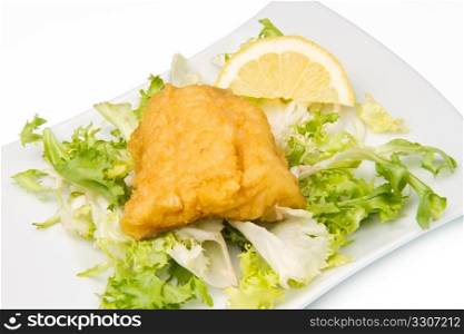 fried cod fish with fresh salad and lemon slice
