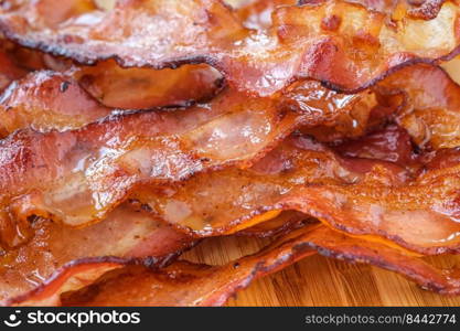 Fried crispy bacon strips close up