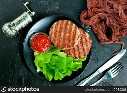 fried cutlet for burger on plate, fried cutlets with sauce