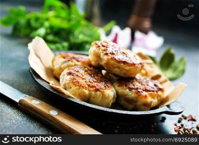 fried cutlets on plate and on a table