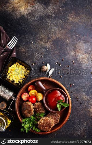fried cutlets with tomato sauce and fresh tomato
