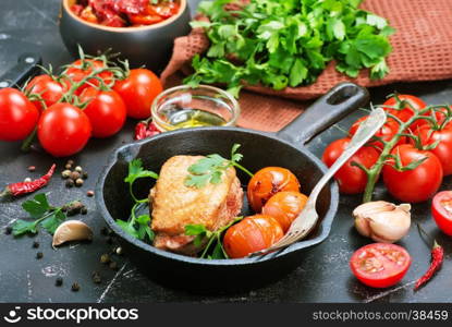 fried duck on pan and on a table