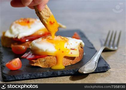 Fried egg and cheese on toasts