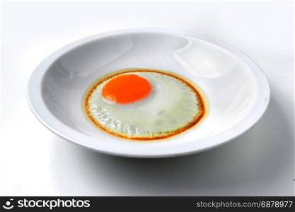 fried egg in white plate