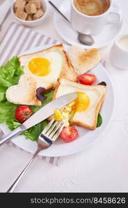 Fried Egg on Toast Bread and cup of fresh hot coffee on light grey background.. Fried Egg on Toast Bread and cup of fresh hot coffee on light grey background