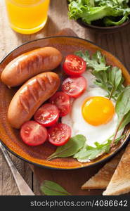 fried egg sausages tomatoes for healthy breakfast