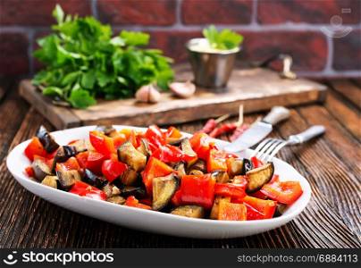 fried eggplant with other vegetables on the plate