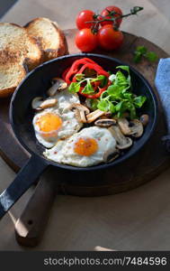 Fried Eggs And Vegetables In A Frying Pan