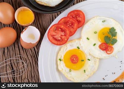 Fried eggs in a frying pan and raw eggs, organic food for good health, high in protein.