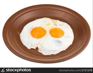 fried eggs on ceramic brown plate isolated on white background