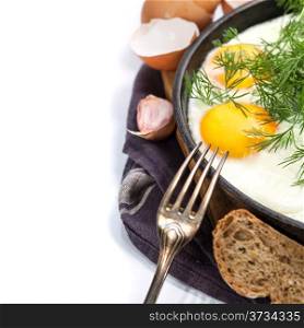 Fried eggs with fresh vegetables over white