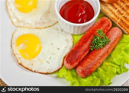 Fried eggs with sausages