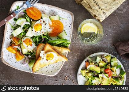 fried eggs with vegetables, top view, diet salad with quail eggs