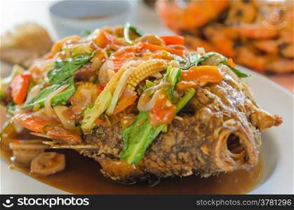 fried fish. Close up deep fried fish with thai style sweet and sour sauce