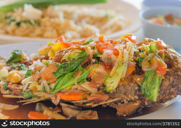 fried fish. Close up deep fried fish with thai style sweet and sour sauce