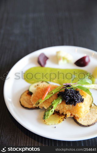 Fried fish fillet with green sauce