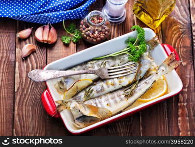 fried fish in bowl and on a table