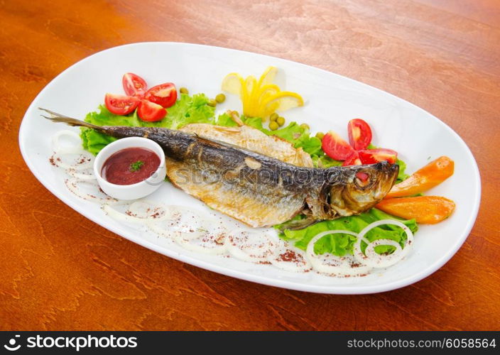 Fried fish in the plate