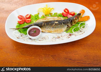 Fried fish in the plate