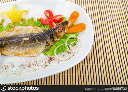 Fried fish in the plate