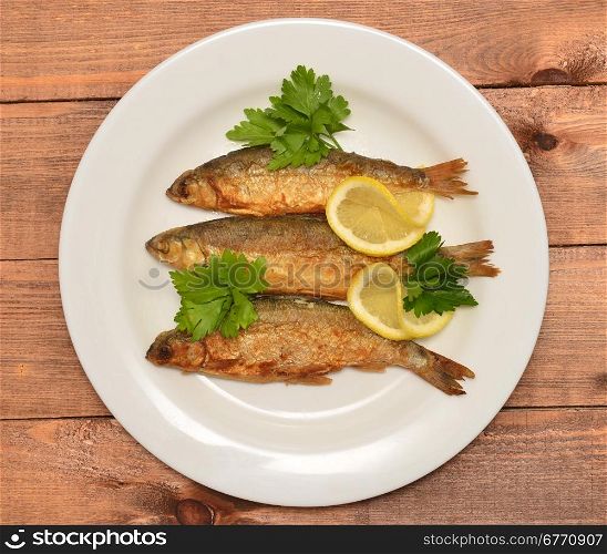 fried fish on white plate