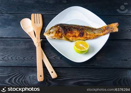 Fried fish served on the plate