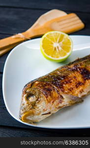 Fried fish served on the plate