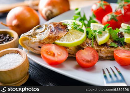 Fried fish served on the plate