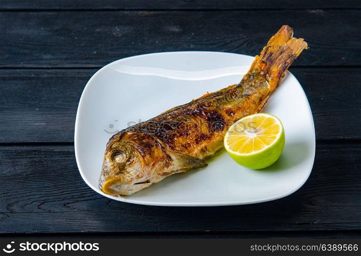 Fried fish served on the plate