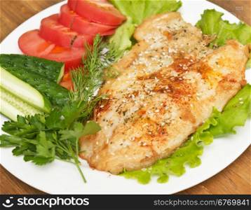 fried fish with spice and vegetables