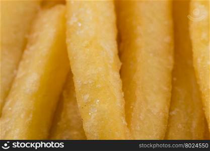 Fried french fry potatoes closeup for background