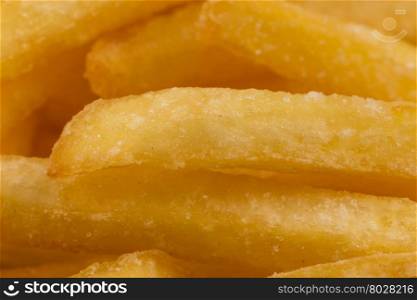 Fried french fry potatoes closeup for background