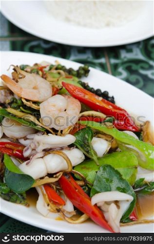 fried herbal vegetables with shrimp and squid