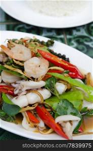 fried herbal vegetables with shrimp and squid